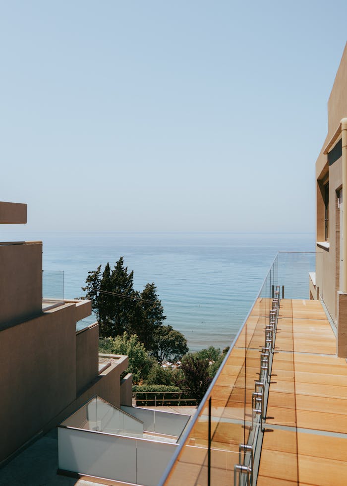 Contemporary building architecture with sea view in Agios Gordios, Greece, perfect for travel and luxury tourism imagery.